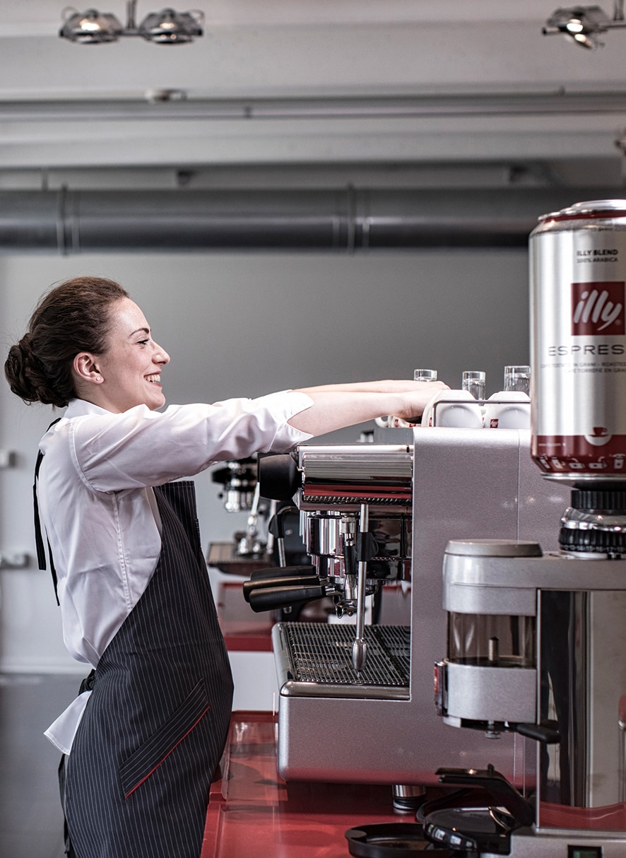 illy professional barista making coffee